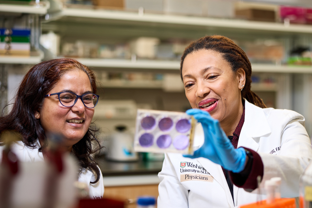 Dineo Khabele, MD, right, works with scientist Viju Gupta, PhD, in a lab at Washington University School of Medicine. Medical philanthropy from supporters empowers such research and breakthroughs.
